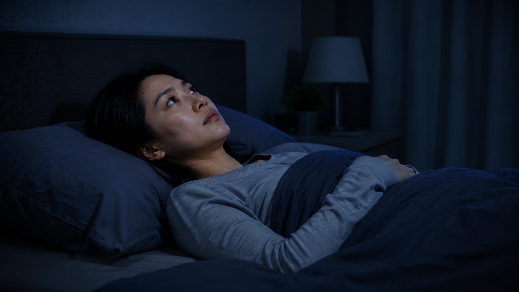 insomnia symptoms in a young woman having difficulty falling asleep at night